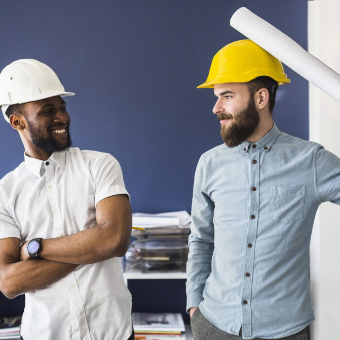 two-young-male-happy-architects-making-fun-office